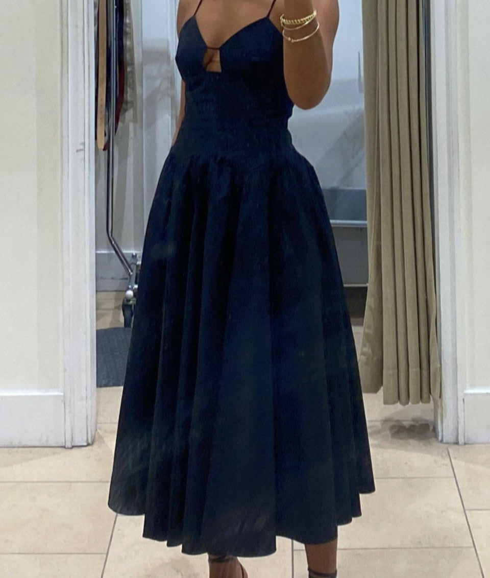 Black cotton poplin midi dress styled with strappy sandals